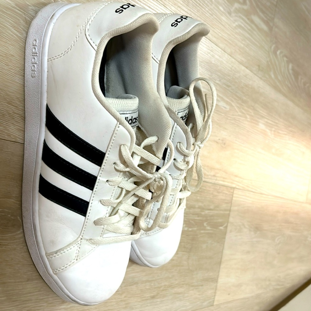 Size 6.5 in children or 8am women’s adidas black/ white  sneakers for sale.